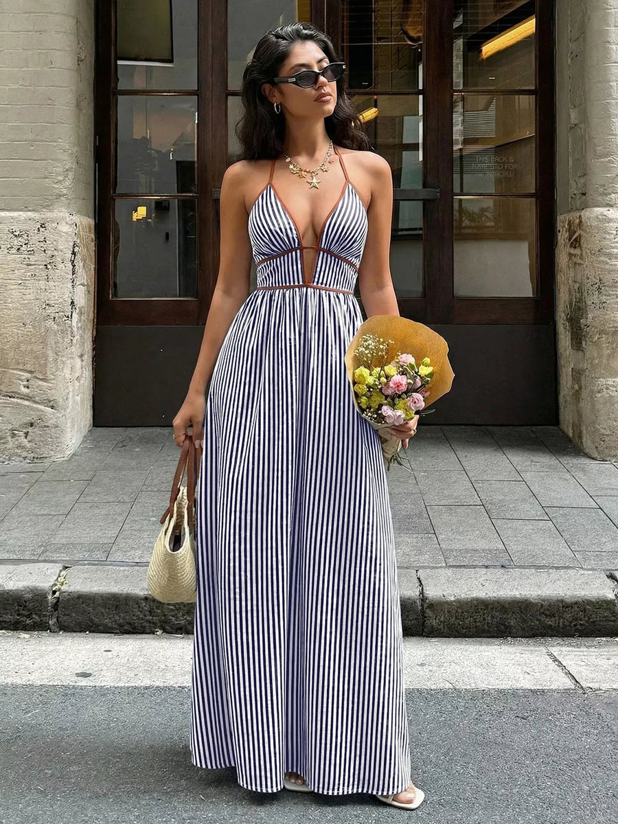 Elegant halter neck striped maxi dress with plunging neckline and brown trim.