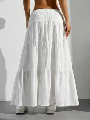 White tiered maxi skirt with elastic waistband and subtle vertical texture