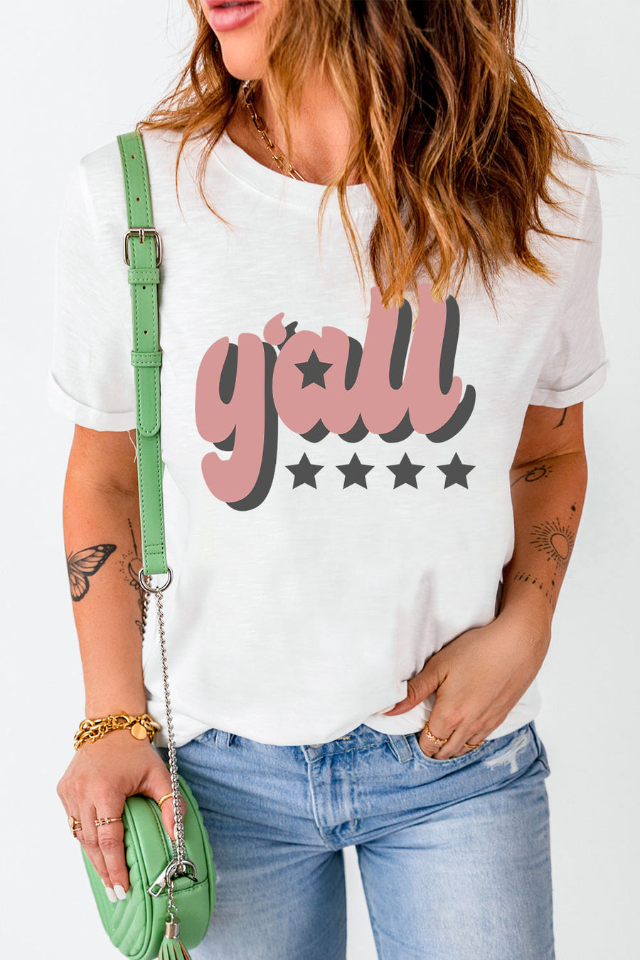 White graphic t-shirt with retro "Y'all" text and stars design