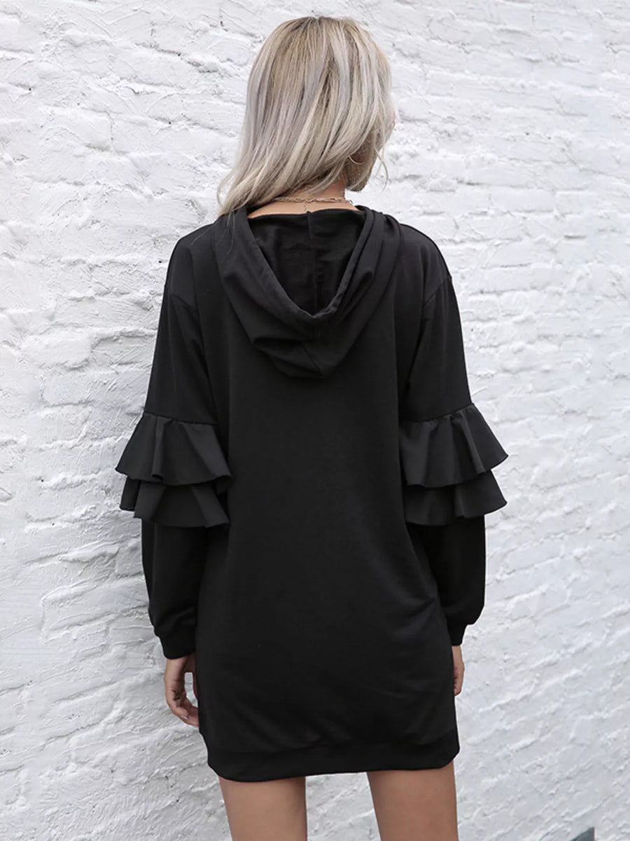 Black hooded mini dress with tiered ruffle trim sleeves.