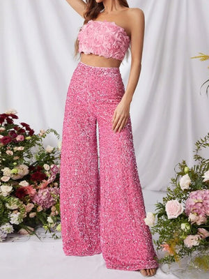 Pink sequin wide leg pants with a flowy cut.