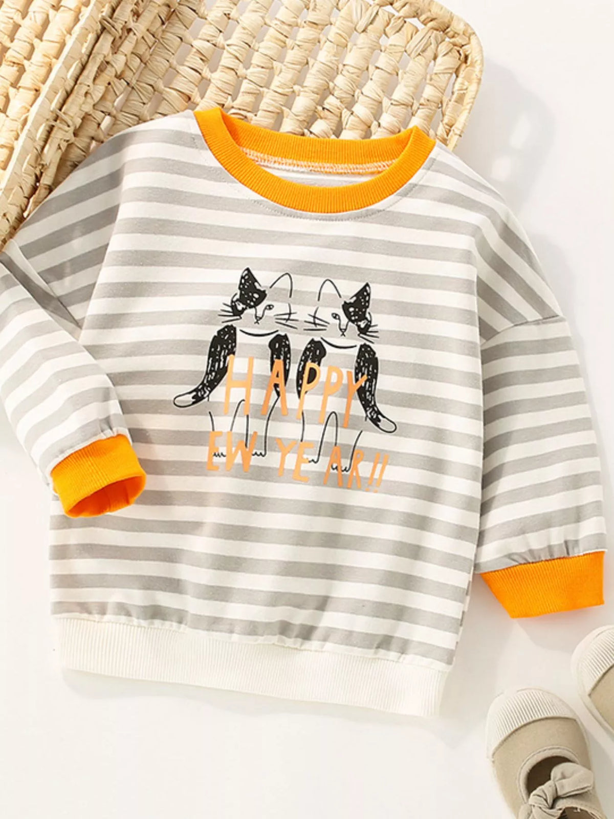 Striped crew-neck sweatshirt in light gray with orange trim and a cat graphic.