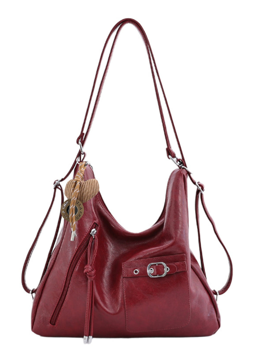 PU Leather Crossbody Bag With Heart Charm in Black with adjustable strap