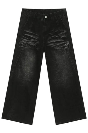 Faded black denim palazzo trousers with a wide leg and distressed details.