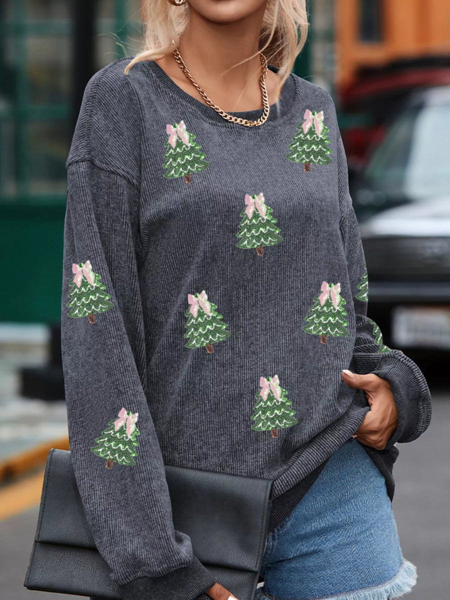 Dark gray baggy sweatshirt with allover sequin Christmas trees and pink bows.