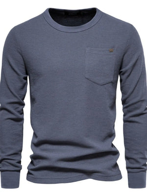 Gray textured thermal long sleeve tee with crew neck and chest pocket.