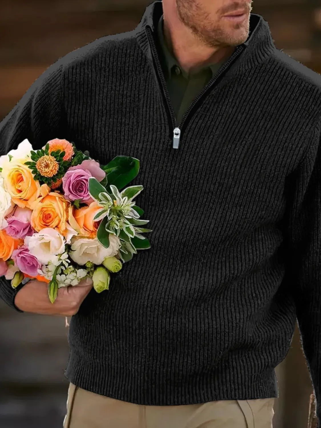 Textured ribbed quarter-zip sweater in black with a casual fit.