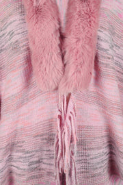 Textured knit cape in dusty pink with faux fur collar and fringe detail