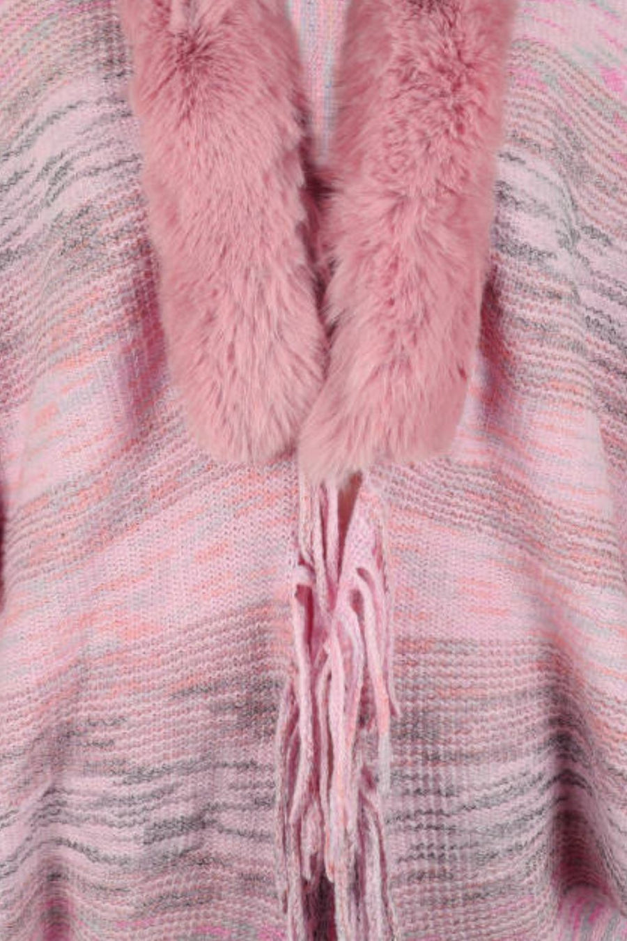 Textured knit cape in dusty pink with faux fur collar and fringe detail