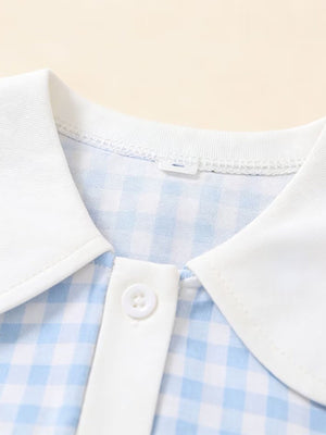 Sky blue gingham toddler dress with white collar and button detail.