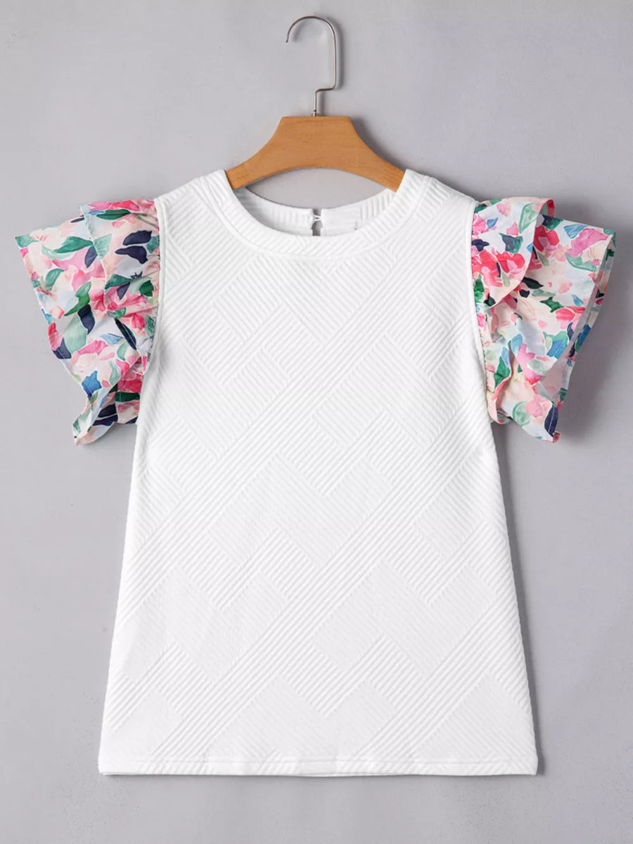 White geometric knit top with floral ruffled sleeves
