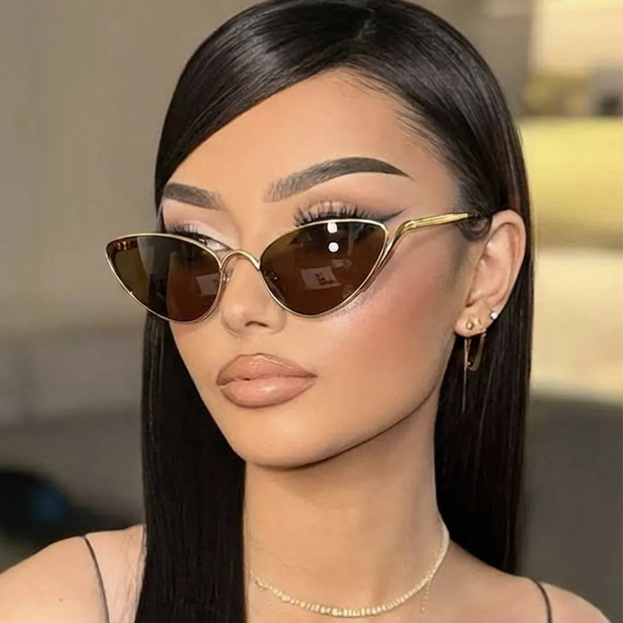metal Frame material: Metal Lens material: Polycarbonate Temple material: Metal sunglasses in black with cat-eye silhouette