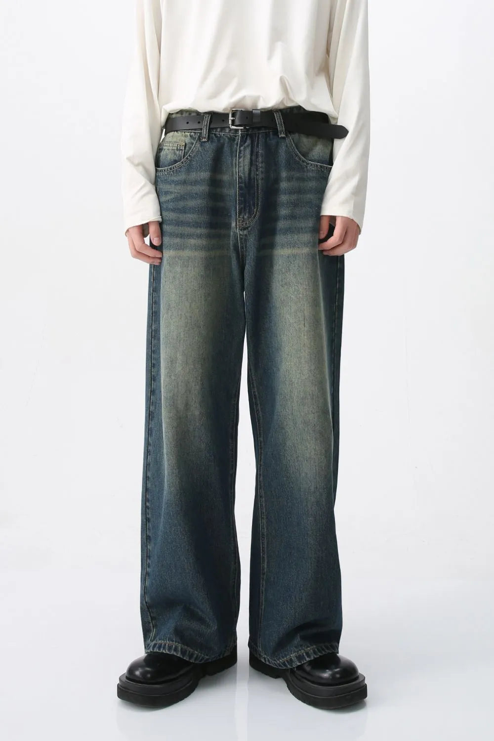 Faded wash wide-leg denim jeans in medium blue with a relaxed fit.