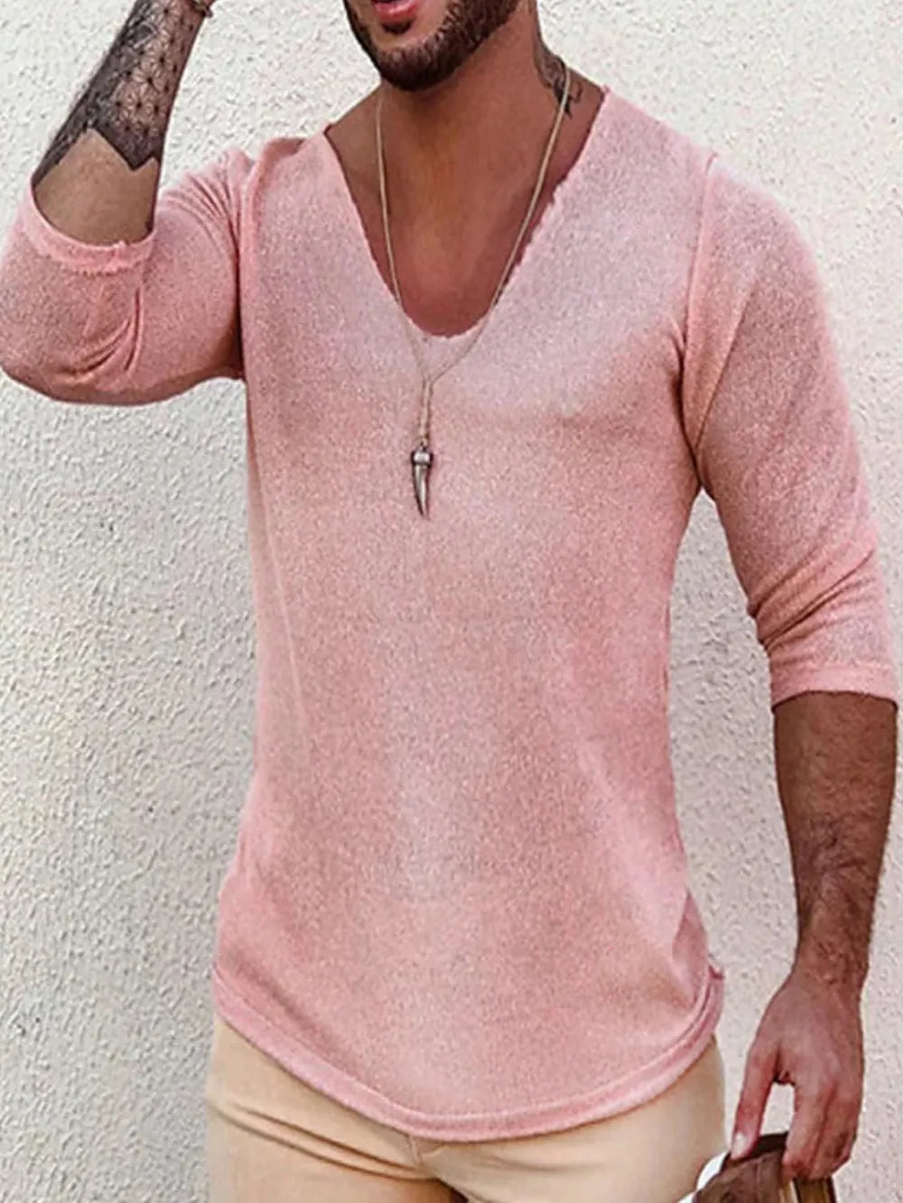 Textured slouchy v-neck knit top in dusty pink with a relaxed fit.