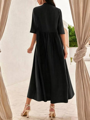Black midi dress with stand collar, button-down front, and gathered waist.