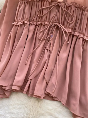 Apricot chiffon blouse with ruffled neckline and tie-front detail