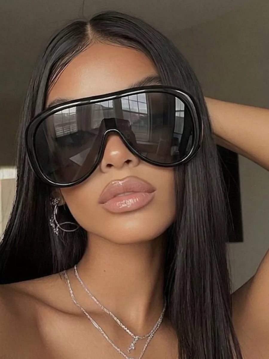 sunglasses in black featuring UV protection and oversized fit
