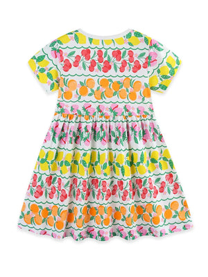 Girls white short sleeve dress with fruit print and tiered skirt.
