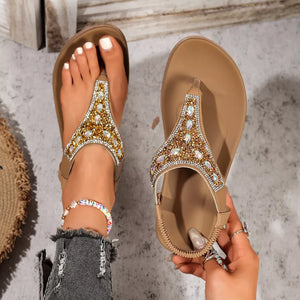 Brown rhinestone-embellished toe post sandals with a comfortable casual style.