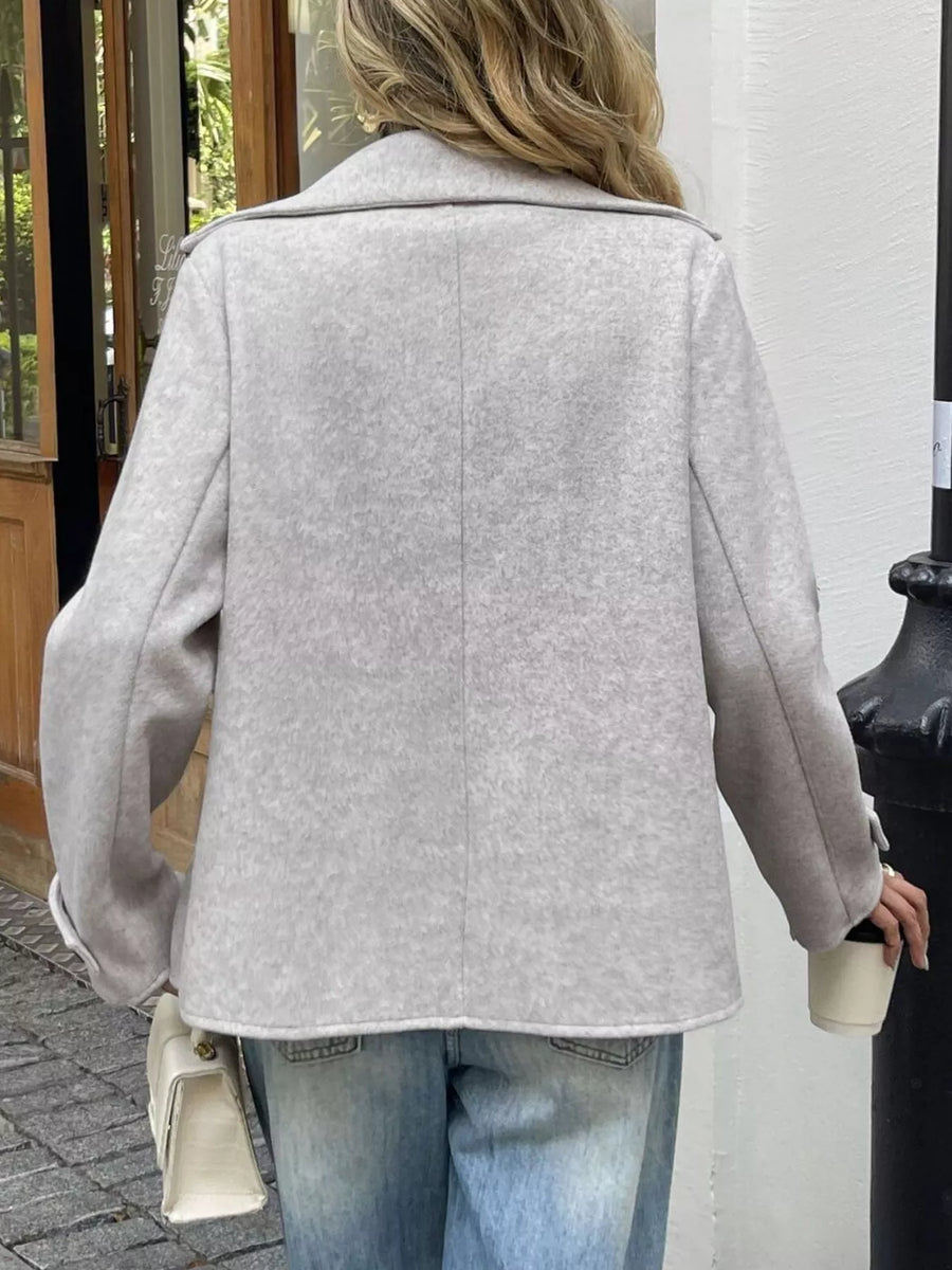 Wool blend double-breasted jacket in apricot, featuring a classic collar and relaxed fit.