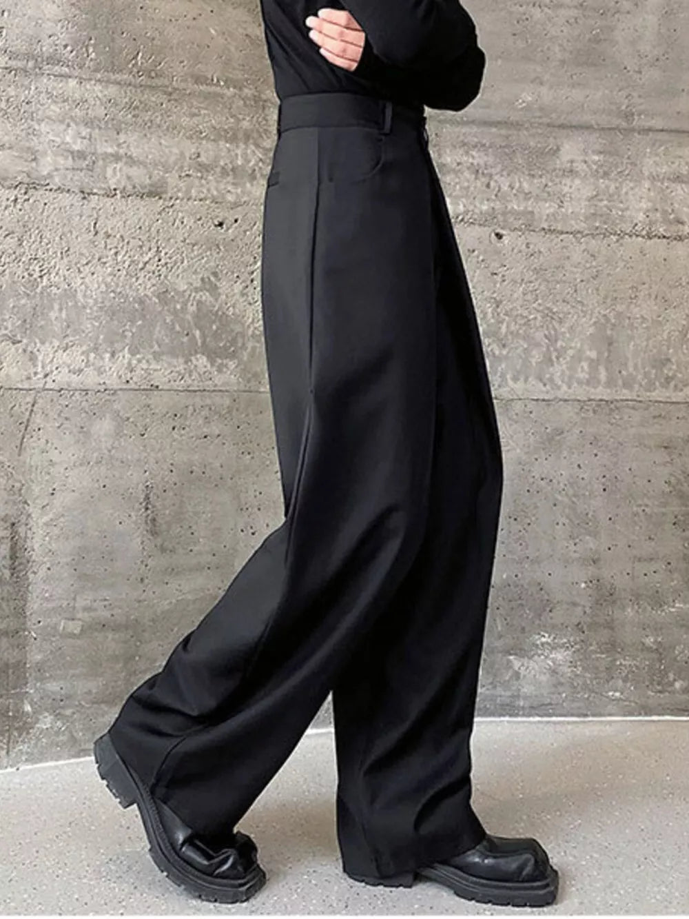 Men's black wide-leg dress pants with a relaxed fit and classic styling.