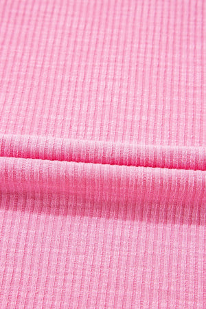 Pink ribbed knit blouse with pastel stripe sleeves