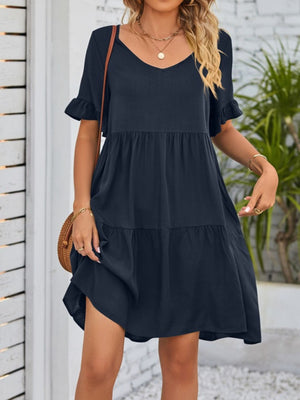 Navy ruffled sleeve mini dress with tiered skirt and v-neck.
