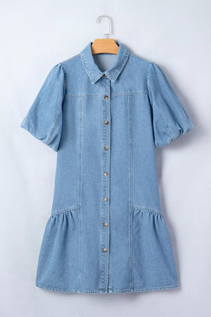 Light blue denim dress with puff sleeves, button front, and ruffled hem.