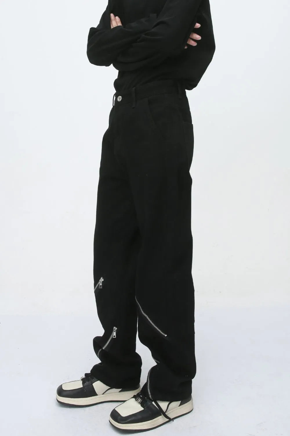 Black straight leg jeans with zip details on the legs.