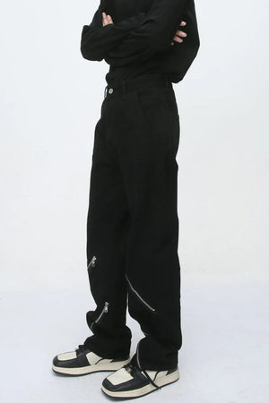 Black straight leg jeans with zip details on the legs.
