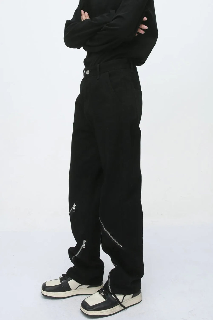 Black straight leg jeans with zip details on the legs.