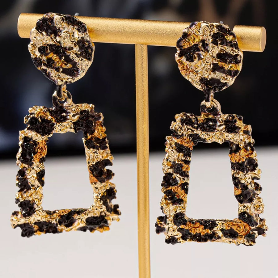 earrings in black with leopard and dangle