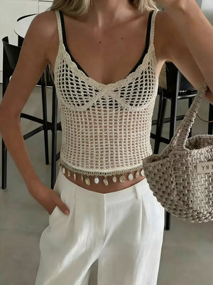Cream crochet knit cami vest with shell trim and a v-neckline.