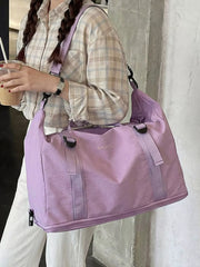 Spacious purple nylon travel bag with buckle straps and crinkled texture.