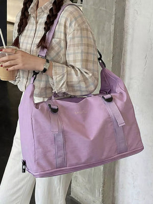 Spacious purple nylon travel bag with buckle straps and crinkled texture.