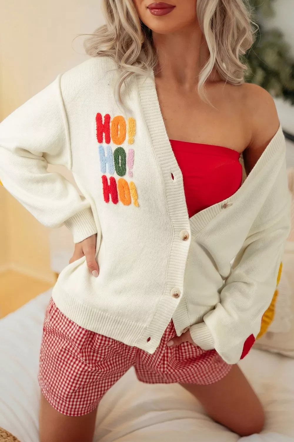 cardigan in ivory featuring buttoned and relaxed fit