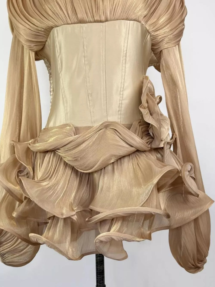 Gold ruffled mini dress with corset waist and sheer sleeves.