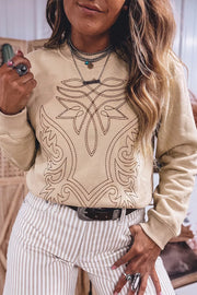 Tan sweatshirt featuring embroidery and embroidered