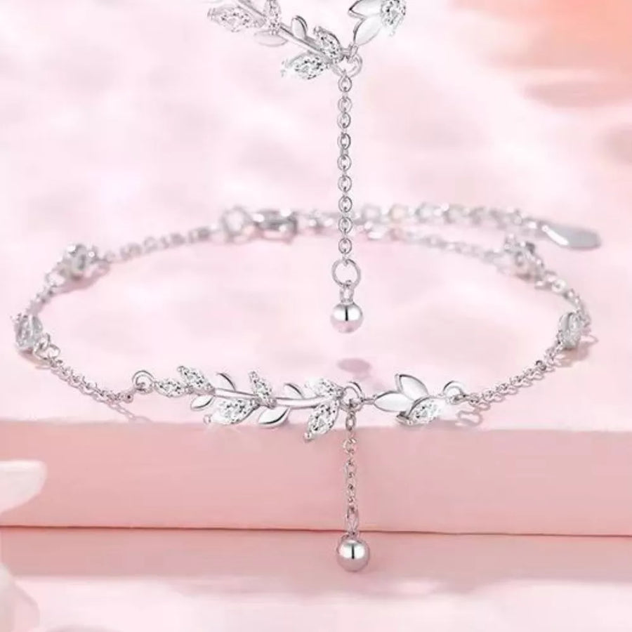 clear bracelet featuring leaf motif and floral