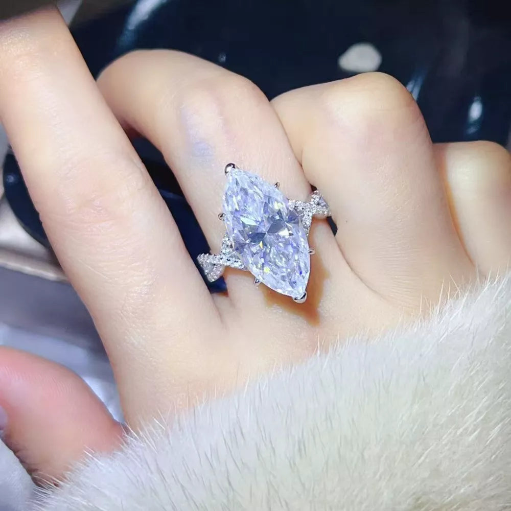 ring in clear featuring marquise cut stone and statement fit