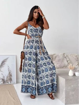 Paisley patterned romper in Peacock Blue with wide legs and a tied waist.