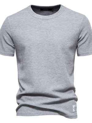 Gray textured crew-neck t-shirt knit with short sleeves and a small logo patch.