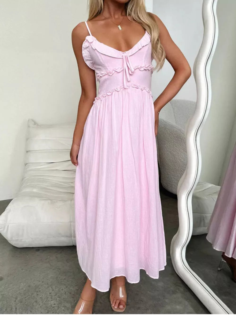 Pink ruffled midi dress with spaghetti straps and tie front