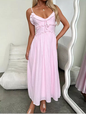 Pink ruffled midi dress with spaghetti straps and tie front