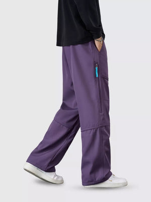 Purple cargo pants with zipper pockets and drawstring waist, loose fit.