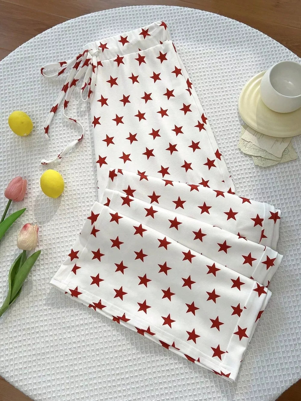 white pants with star-print and N/A