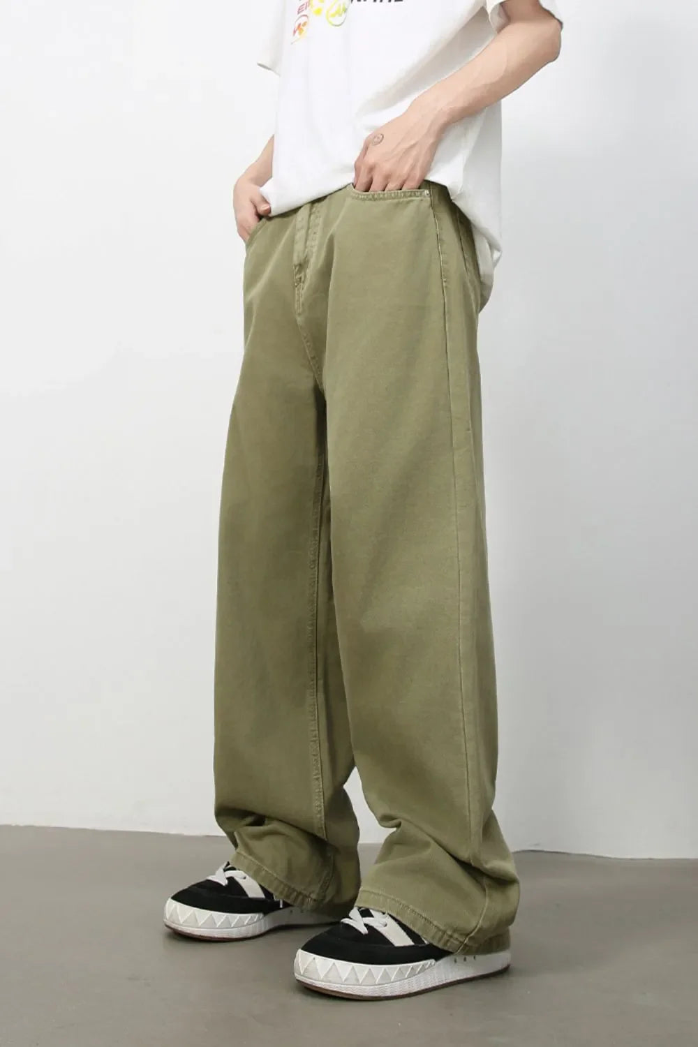 Yellow-green wide-leg rigid denim trousers with a casual, relaxed fit.