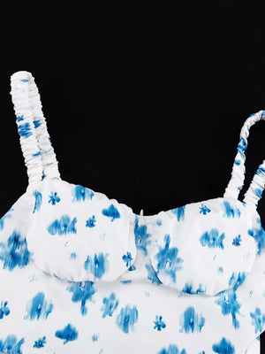 White cami with blue abstract floral print and ruched straps