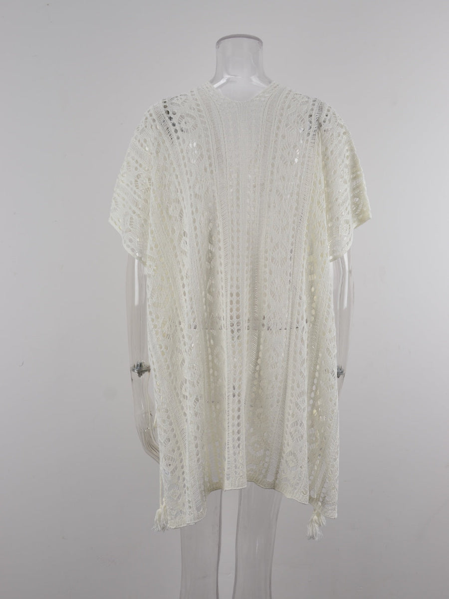 White open-knit V-neck beach cover-up with short sleeves and tassel details.