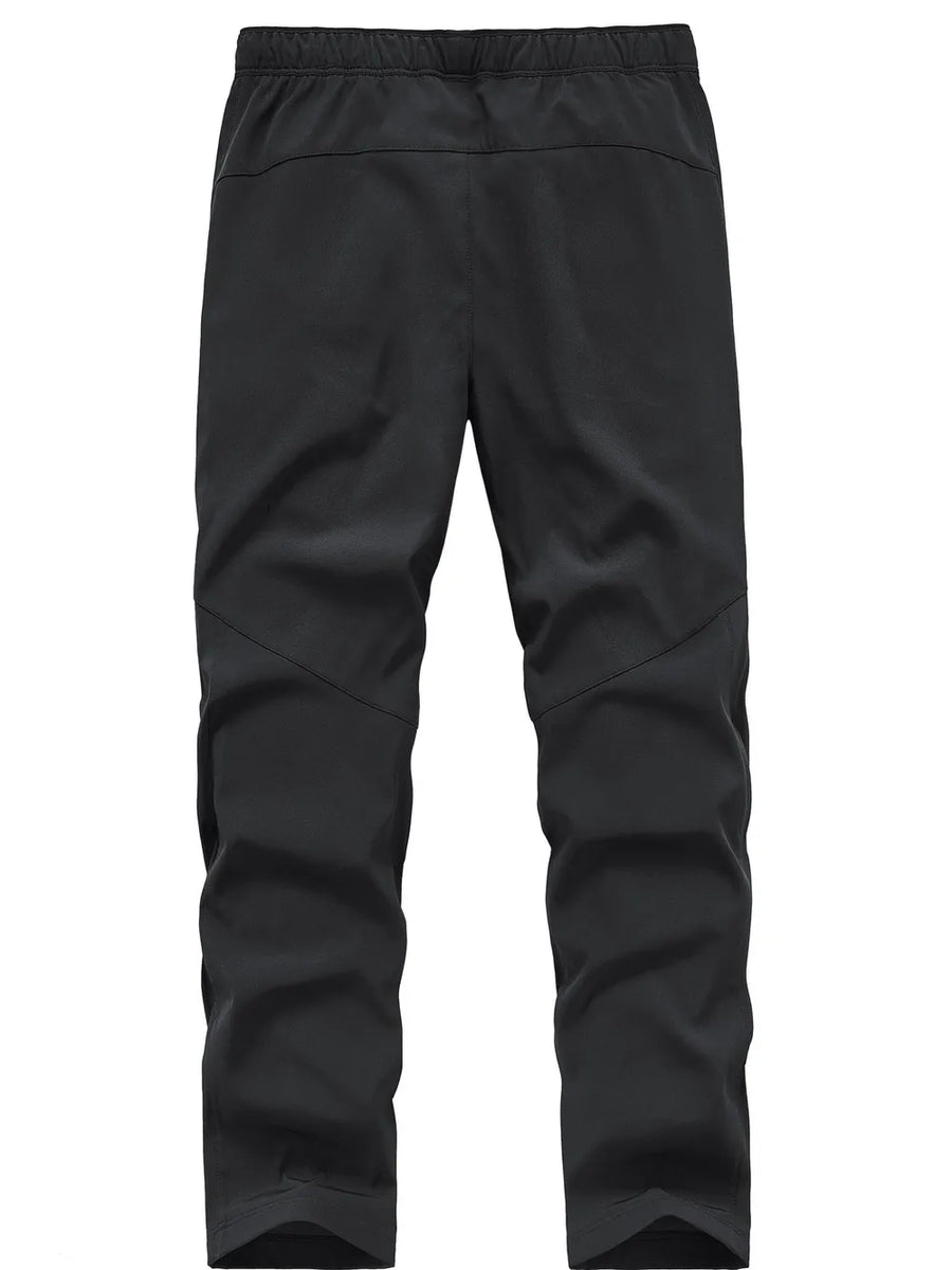 Black men's sweatpants with elastic waistband and paneled legs.